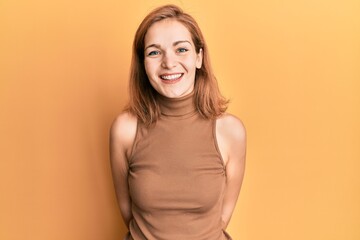 Obraz premium Young caucasian woman wearing casual style with sleeveless dress with a happy and cool smile on face. lucky person.