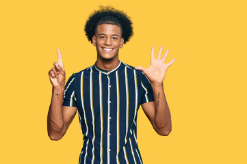 African american man with afro hair wearing casual clothes showing and pointing up with fingers number six while smiling confident and happy.