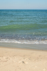 Seashore with  soft wave on sandy beach. Natural background for summer vacation