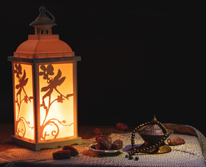 Ramadan concept with dried dates and lantern