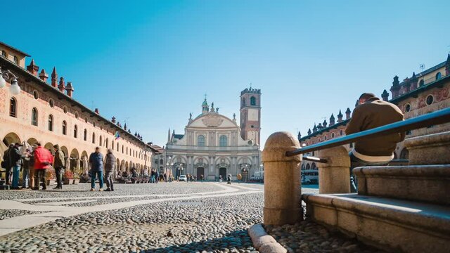 Cathedral with people walking in the Piazza Ducale of Vigevano, Timelapse 4K, Motion blur