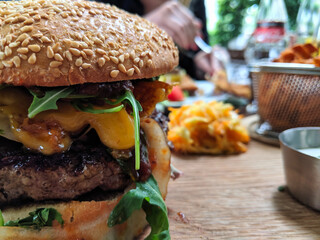 hamburger cheseburger on a table with blurred background