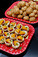 Fruits tarts served on a tray for a party. Sweet dessert.