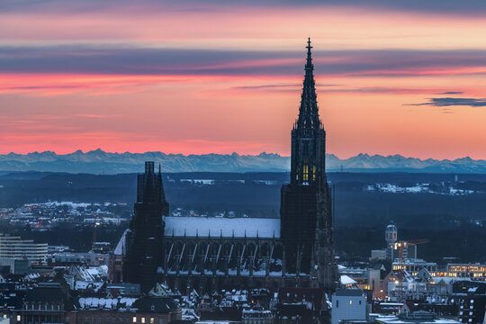 Minster of Ulm and City ulm from above at sunrise sunset with alps mountains in the background in the morning evening baden- w&uuml;rttemberg, germany, german
