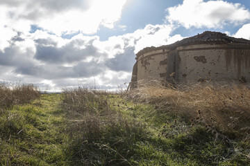 Fototapeta premium Old rural straw store in the middle of the fields
