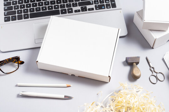 white cardboard box on office desk
