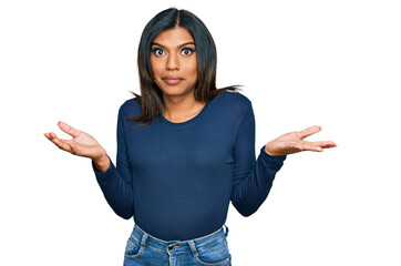 Young latin transsexual transgender woman wearing casual clothes clueless and confused expression...