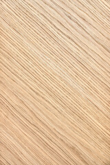 Wooden panel of solid oak with stylish diagonal striped texture as background extreme close view from above
