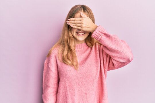 Beautiful young caucasian girl wearing casual clothes smiling and laughing with hand on face covering eyes for surprise. blind concept.