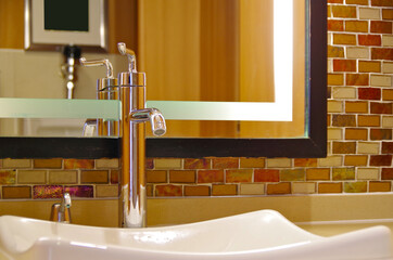 Dated and old fashioned interior design in bathroom of cabin or stateroom onboard classic...