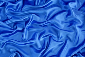 Obraz premium Elegant stylish background from bright blue soft silk material.