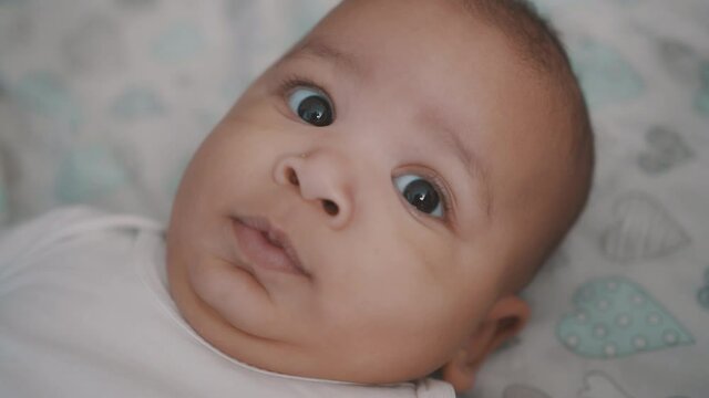 Portrait of cute baby in the crib. High quality 4k footage