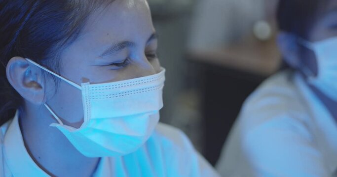 During The Coronavirus 2019 Epidemic (COVID-19), The High School Students Wear A Mask While Studying In The Computer Room.