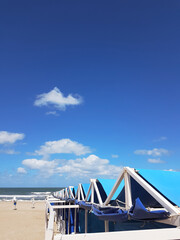 view of the awning of a line of tents on an Argentine beach