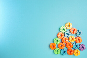  Plastic building blocks isolated on blue background. Top view with copy space