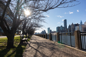 Empty Riverfront on Roosevelt Island in New York City along the East River with the Midtown Manhattan Skyline