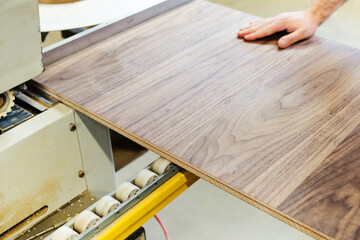 Manufacturing of high quality veneer furniture. The process of gluing an edge onto a manufactured...