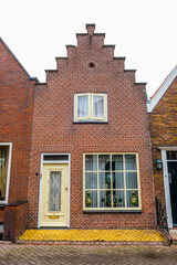 VOLENDAM, NETHERLANDS. Typical Dutch village houses in Volendam. Beautiful village houses facade..