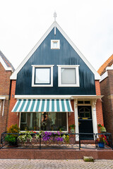 VOLENDAM, NETHERLANDS. Typical Dutch village houses in Volendam. Beautiful village houses facade..