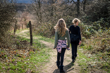 two children walking together free in the nature