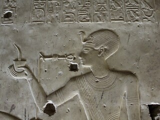 close up carving of young king pharaoh in Seti temple in Sohag in Egypt