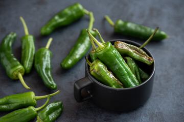 Green fresh chili peppers padron grilled or fried in the Spanish style
