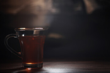 Homemade milk chocolate with almonds and dried strawberries. Pieces of milk chocolate. Set of milk chocolate with tea.