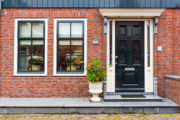 VOLENDAM, NETHERLANDS. Typical Dutch village houses in Volendam. Beautiful village houses facade..