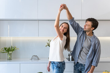 Cute couple dancing in the kitchen