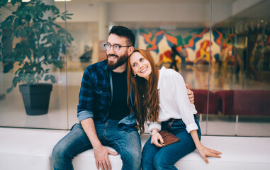 Caucasian boyfriend in optical eyewear for vision correction enjoying relationship with cheerful...