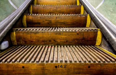 Old, wooden, numbered Escalator steps