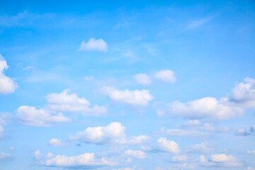Light blue summer sky with small heap clouds