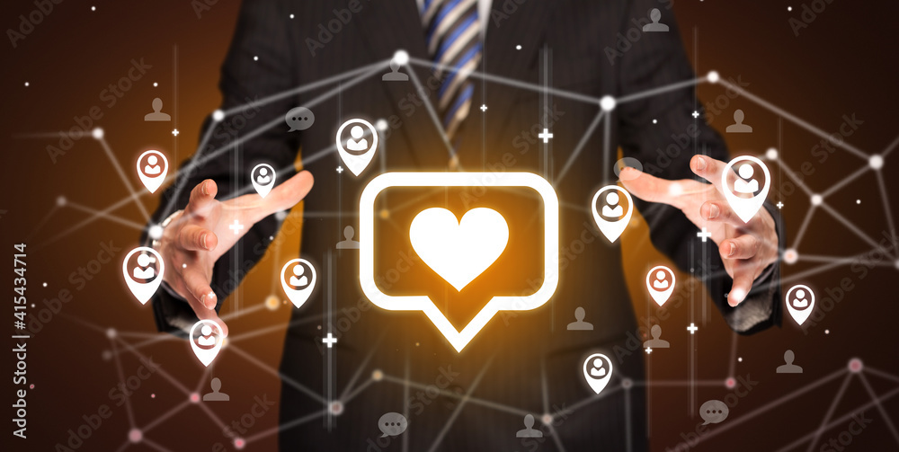 Aufkleber hand holdig speech bubble with a heart icon around his hands, social networking concept