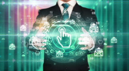 Businessman holding touch user interface icon in his hands with multiple technology symbols around it