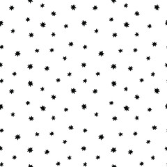 Vector doodle seamless pattern with tiny stars. Black confetti stars isolated on white background.