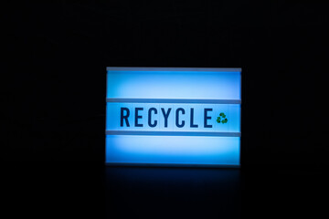 illuminated sign with the concept of recycling.