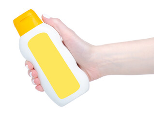 White yellow cosmetic bottle beauty in hand on white background isolation