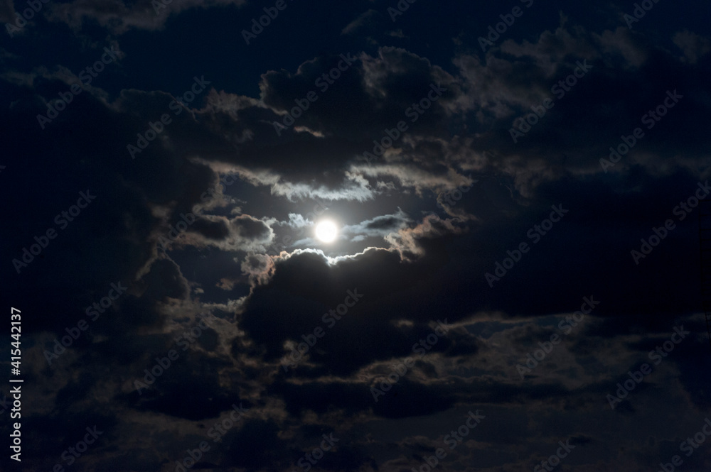 Wall mural a full moon’s glow in the sky at night.