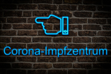 Leuchtreklame Corona Impfzentrum