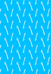 Vertical pattern with white disposable forks on a blue background.