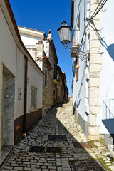 An alley between the old stone houses of Sassinoro, a medieval village in the province of Benevento.