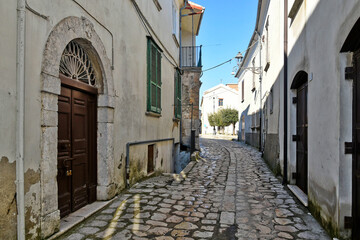 Fototapeta na wymiar A street among the old stone houses of Montefusco, a medieval village in the province of Avellino.