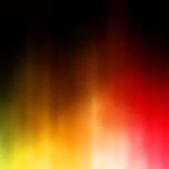 Abstract background, a burst of bright radiance of yellow and red, smoothly turning into black, blur.