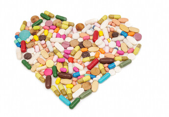group of drugs or medicines arrange in heart shape isolated on white