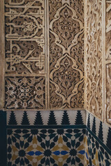 details of the arabesque decorations, typical of the moorish architecture than can be found in the Nasrid palaces of the Alhambra complex in Granada (Spain)