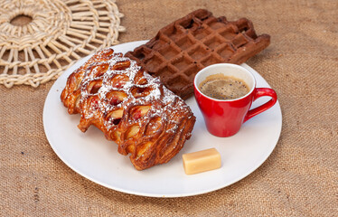 Pastries and espresso coffee on a burlap background