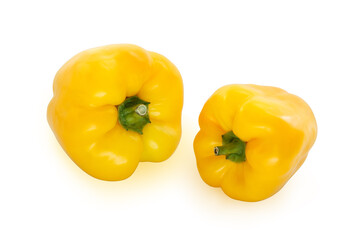 Two yellow bell peppers isolated on white background with a clipping path.