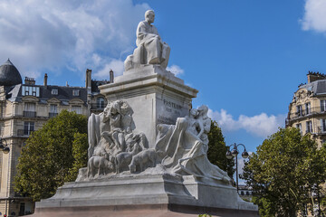 Fototapeta na wymiar Fragment of Louis Pasteur monument. Marble monumental statue Louis Pasteur located in the center of the Place de Breteuil. Paris, France.