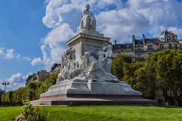 Fragment of Louis Pasteur monument. Marble monumental statue Louis Pasteur located in the center of the Place de Breteuil. Paris, France.