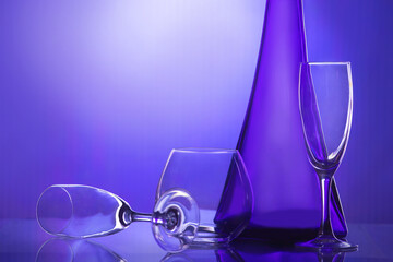 wine bottles and glasses on a bright multicolored background.